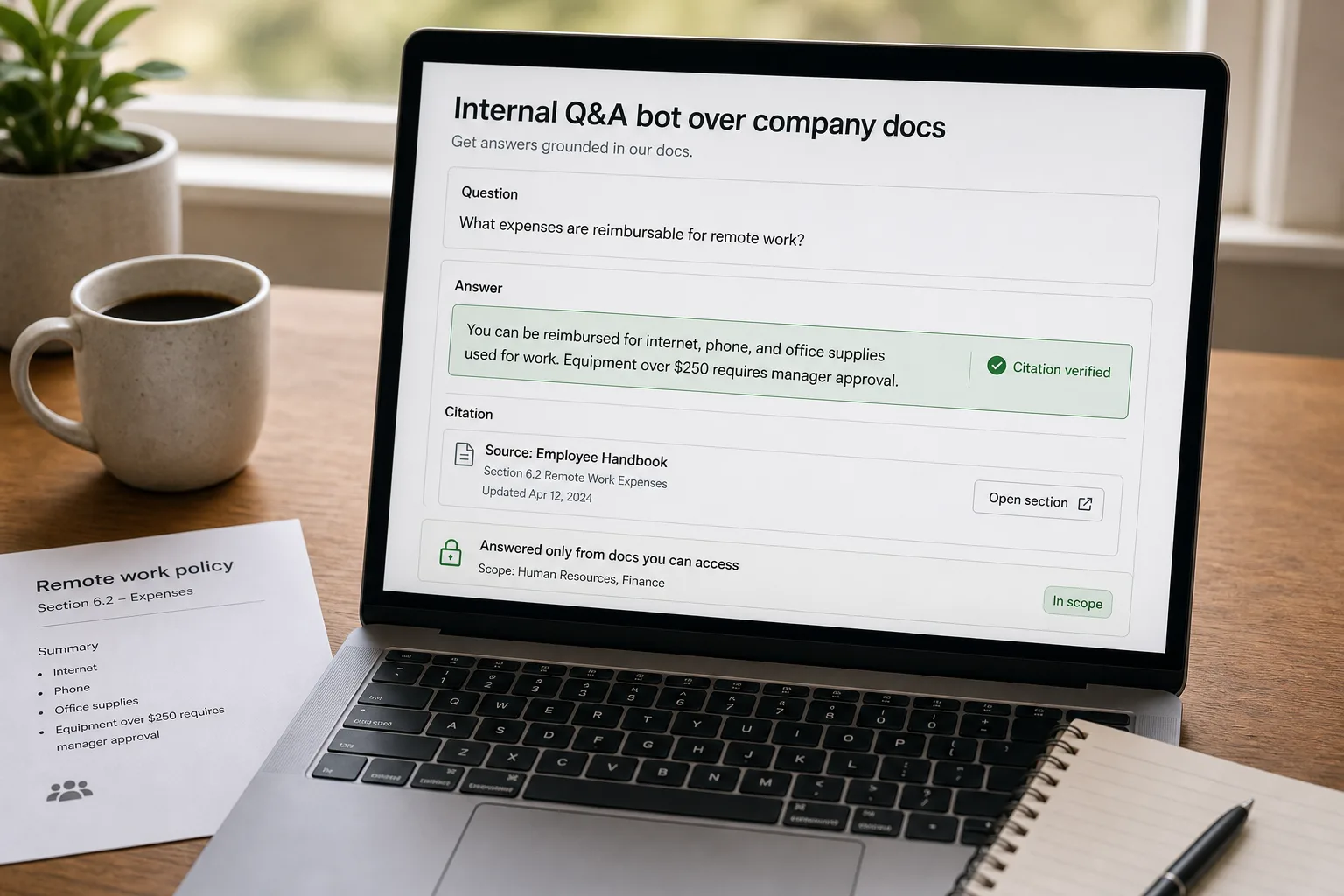 An over-the-shoulder photo of a laptop showing an internal Q&A bot answering a remote-work-expenses policy question, with an inline source citation marked "Citation verified," an amber "last updated 14 months ago" freshness caveat, an access-scoping note, and a printed employee handbook on the desk.